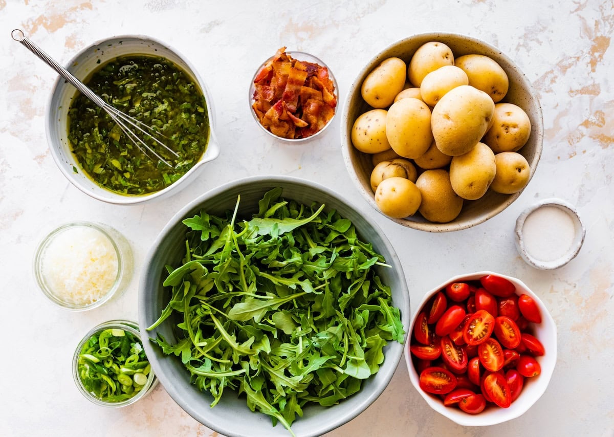 ingredients in bowls to make no mayo potato salad.