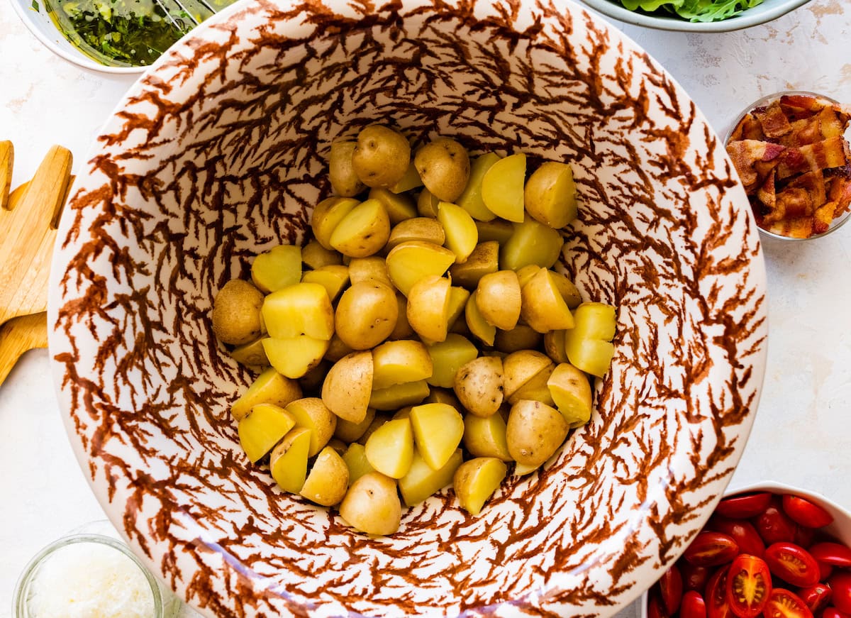 cooked baby potatoes in large bowl.