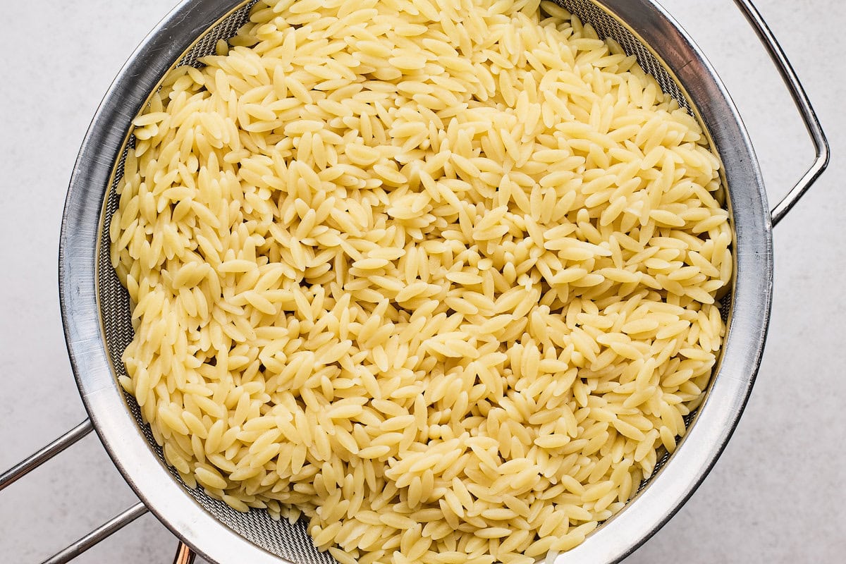cooked orzo in strainer.