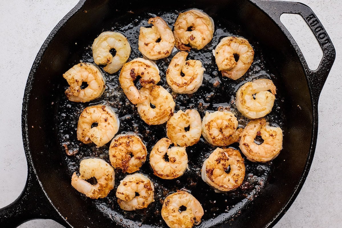 cooked shrimp in cast iron skillet.
