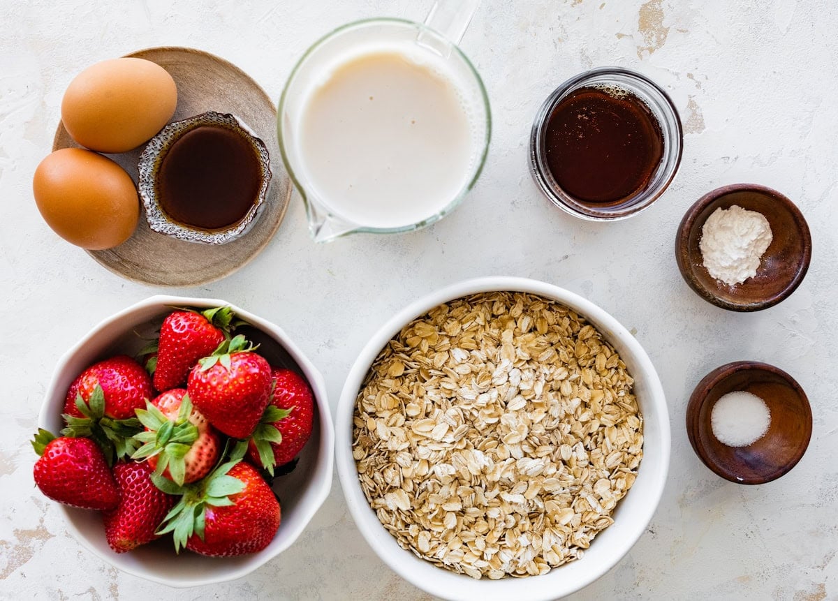 ingredients in bowls to make strawberry baked oatmeal.