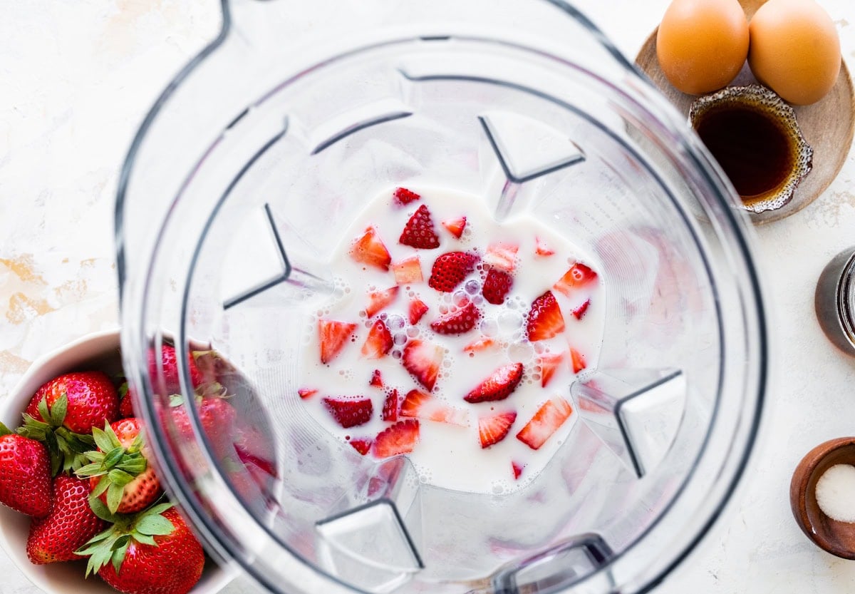 strawberries and milk in blender.
