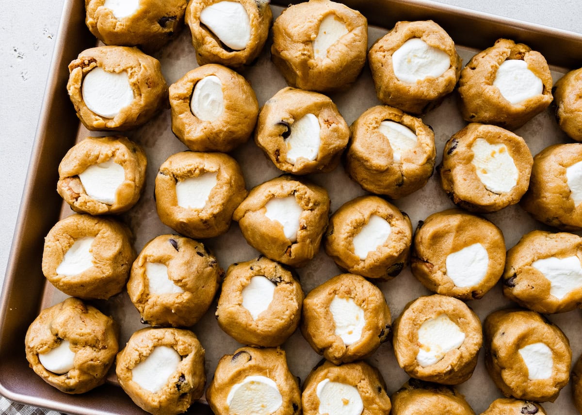 biscoff s'mores cookie dough balls on baking sheet.