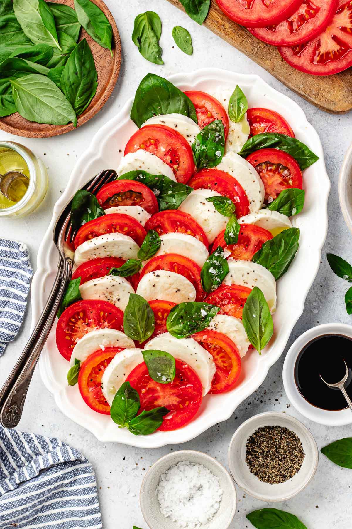 caprese salad on large white platter. 
