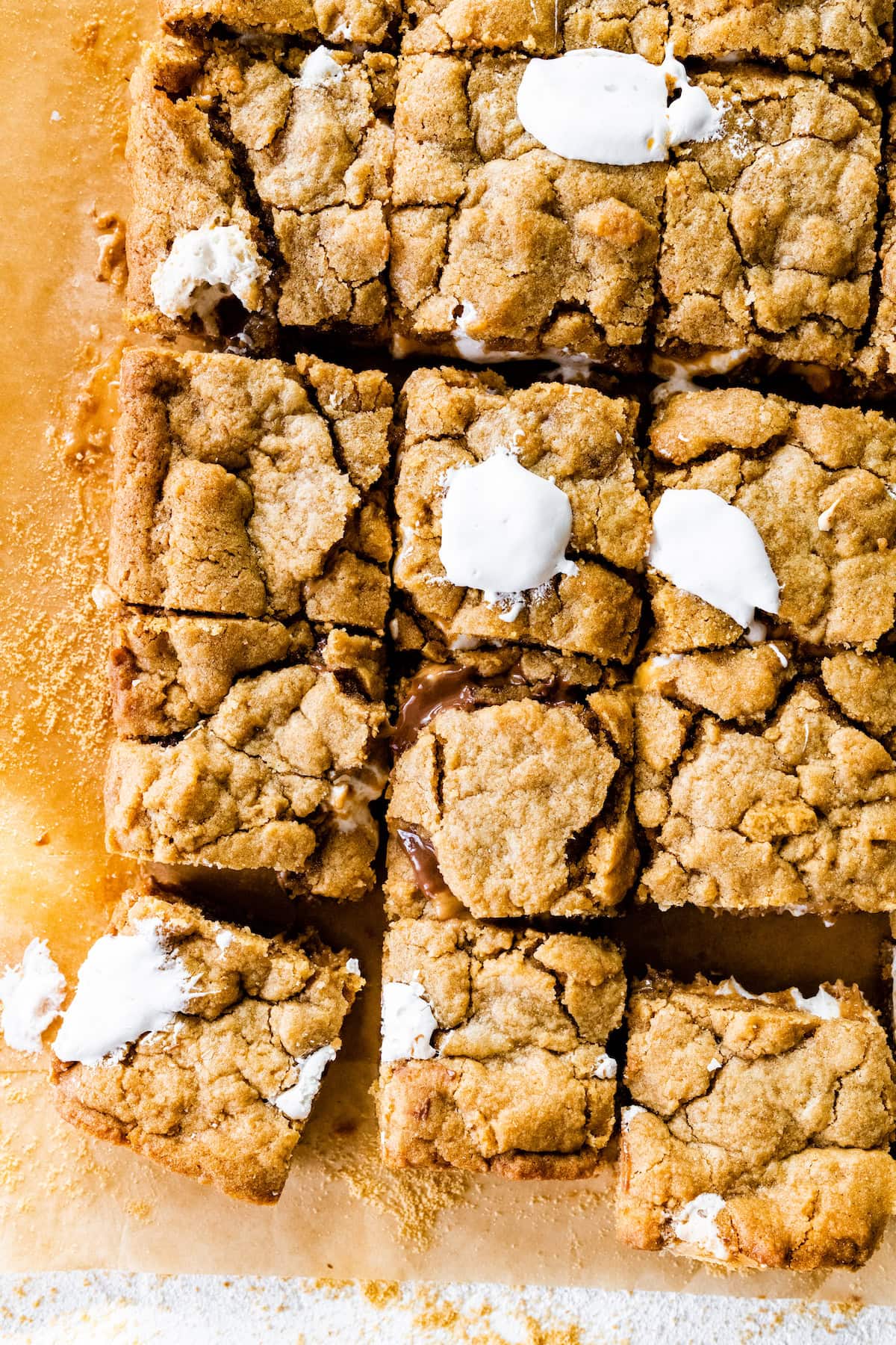 peanut butter s'mores bars cut into squares with marshmallow creme. 