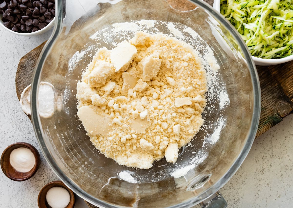 sugar and dry ingredients in mixing bowl to make zucchini brownies.