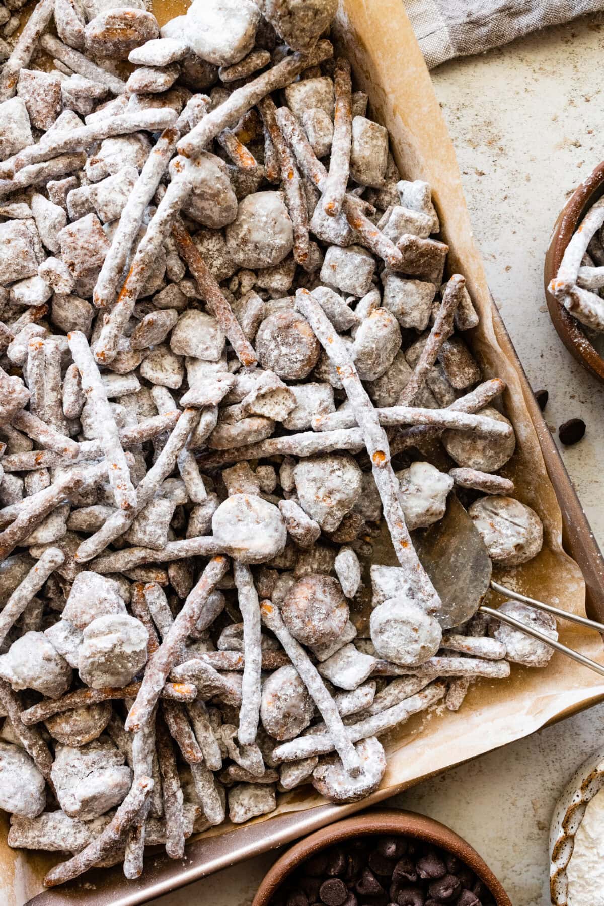 sweet and salty puppy chow on baking sheet.