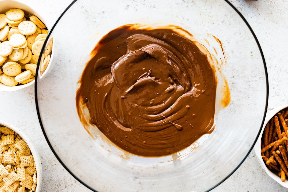 melted chocolate, butter, and peanut butter in glass mixing bowl.