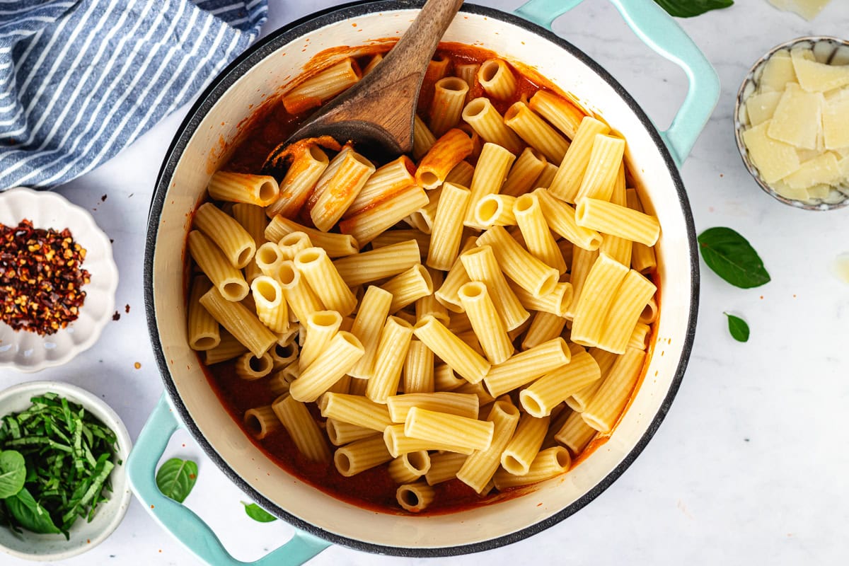 cottage cheese pasta sauce with rigatoni noodles in large pot.
