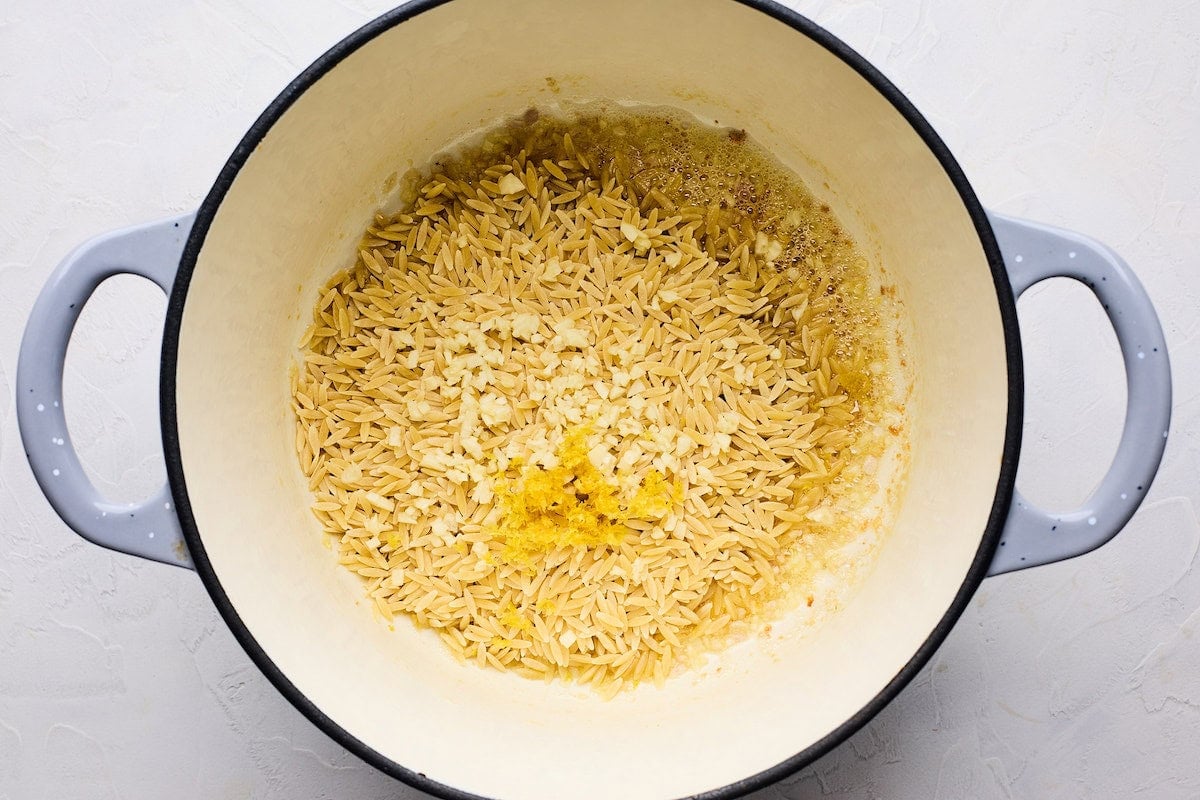 orzo, garlic, and lemon zest in large pot.