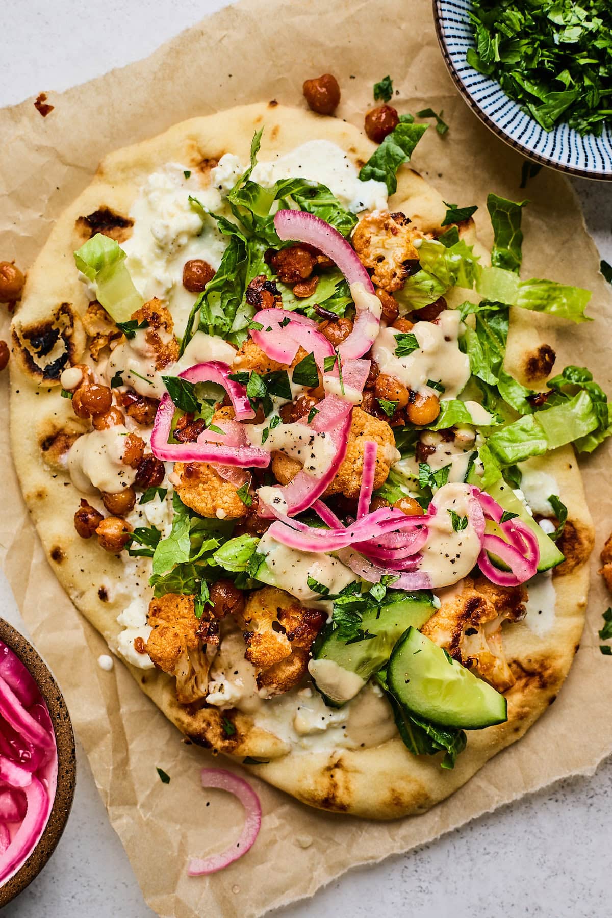 roasted cauliflower chickpea wrap on parchment paper.