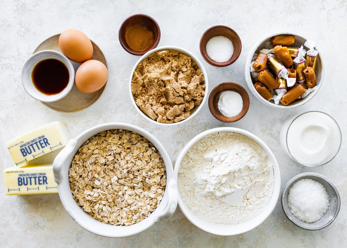 ingredients in bowls to make brown butter caramel oatmeal cookies.