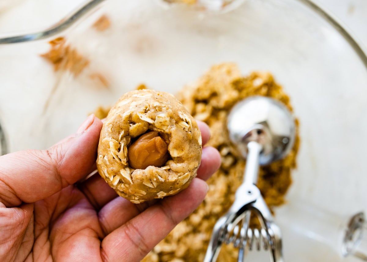 brown butter oatmeal cookie dough wrapped around a caramel.