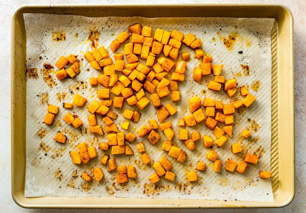 roasted butternut squash on baking sheet with parchment paper.