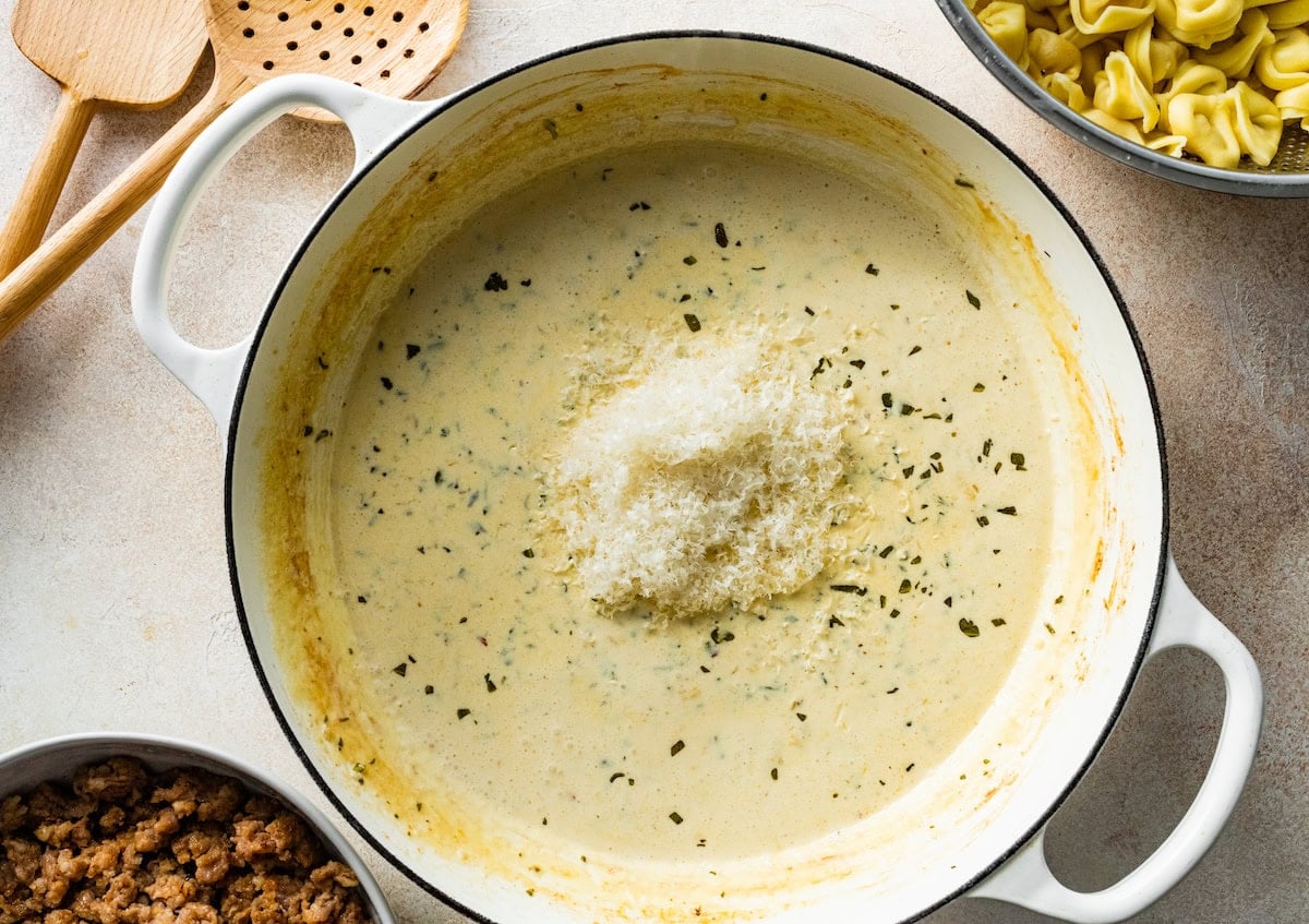 cream sauce with parmesan cheese in skillet.