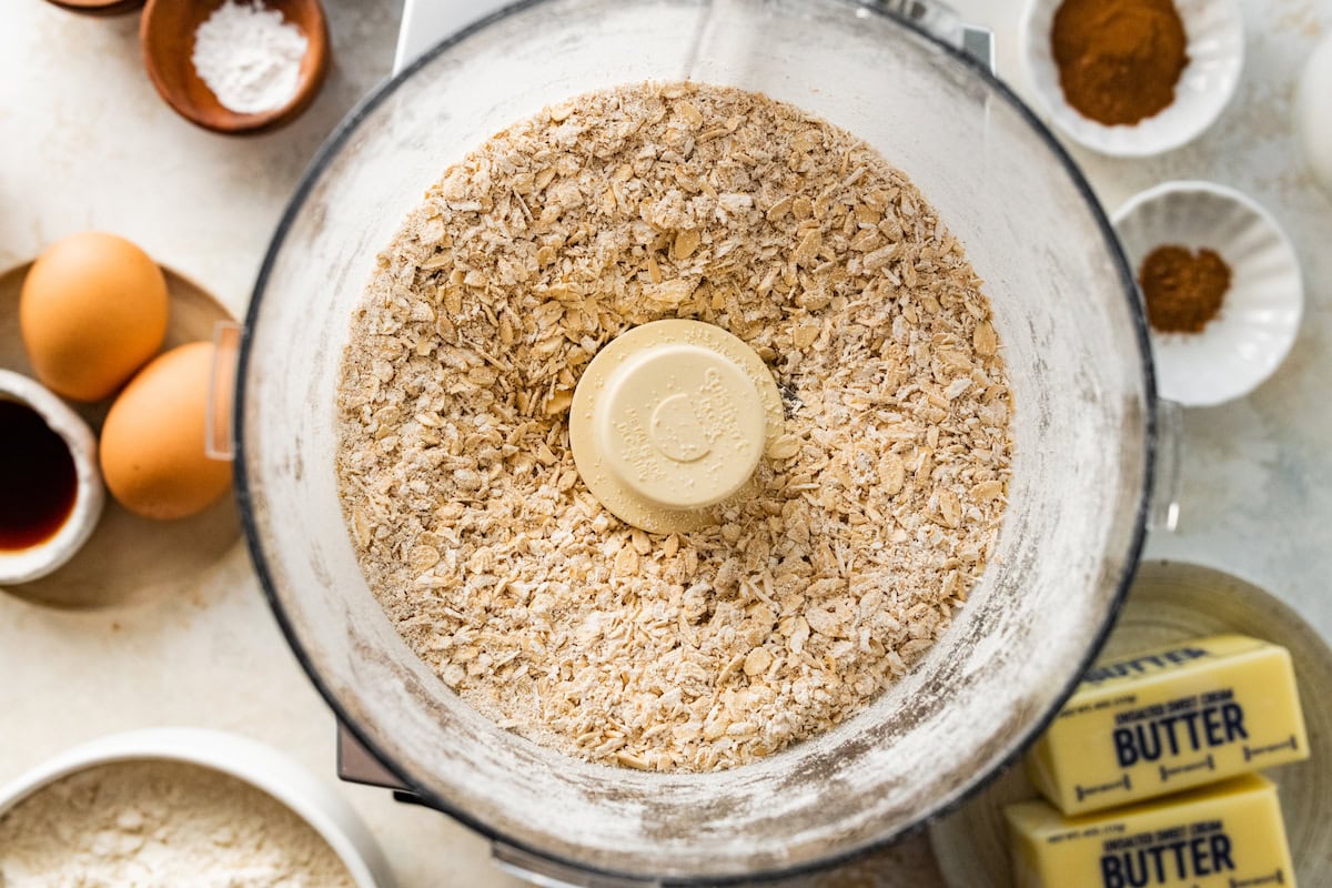 oats being pulsed in a food processor.