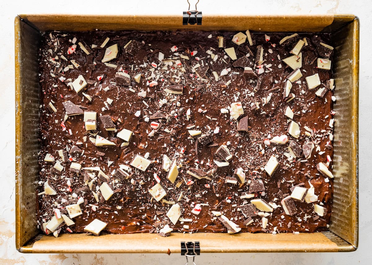 peppermint bark brownie batter spread into pan ready to be baked.