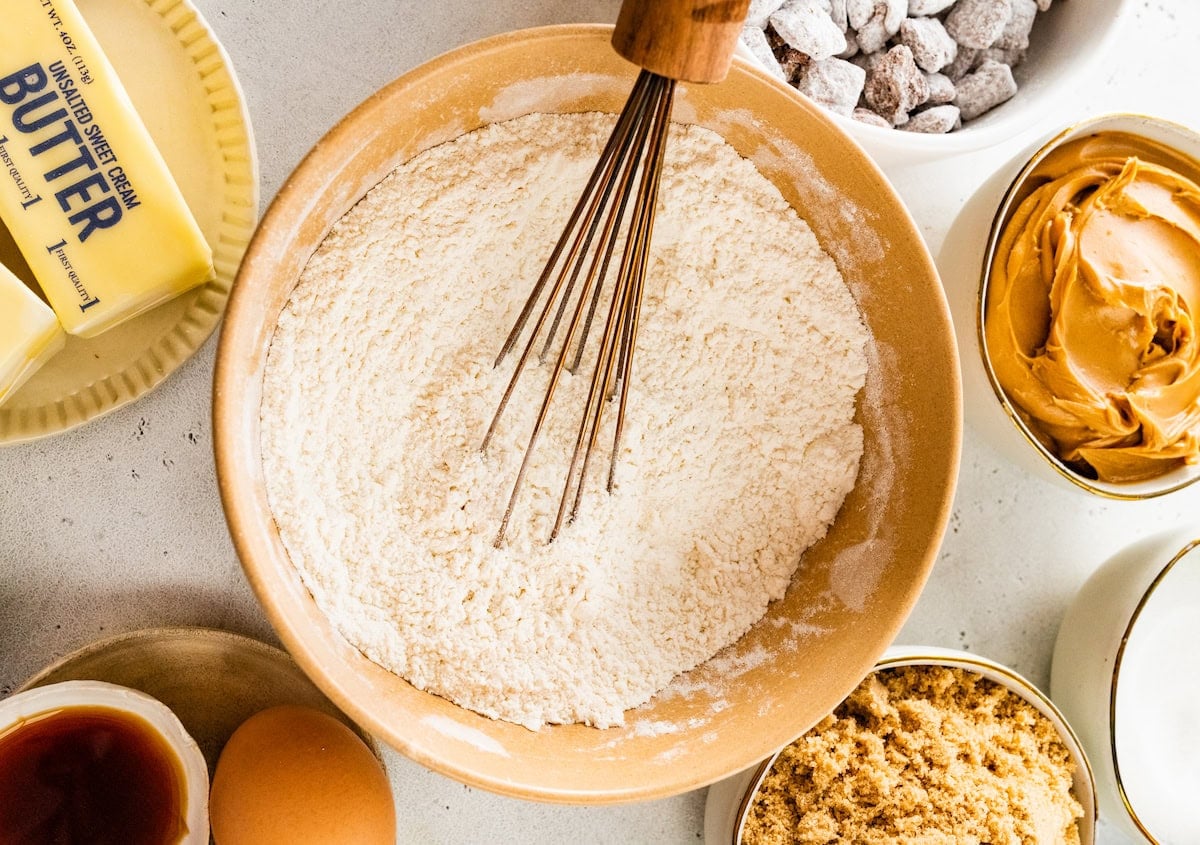 dry ingredients being whisked together in mixing bowl.