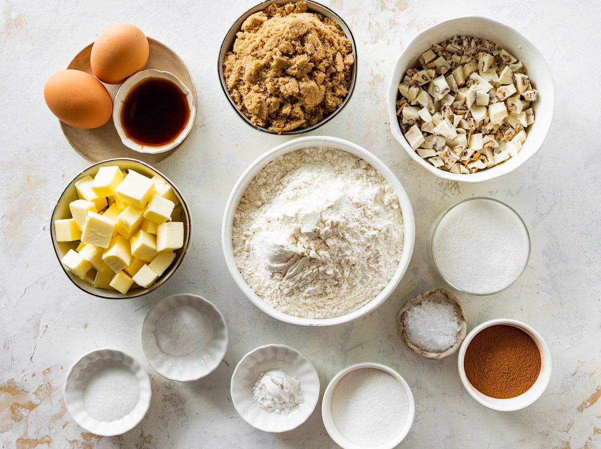 ingredients in bowls to make Brown Butter White Chocolate Candied Pecan Cookies.