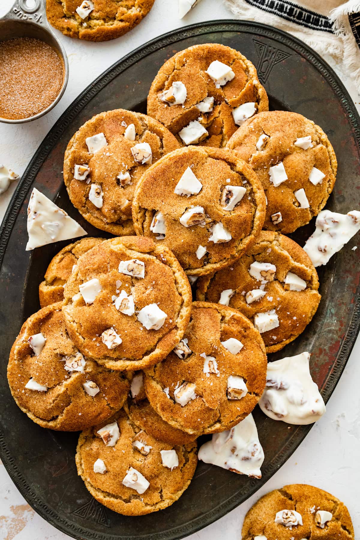 Brown Butter White Chocolate Candied Pecan Cookies on platter.