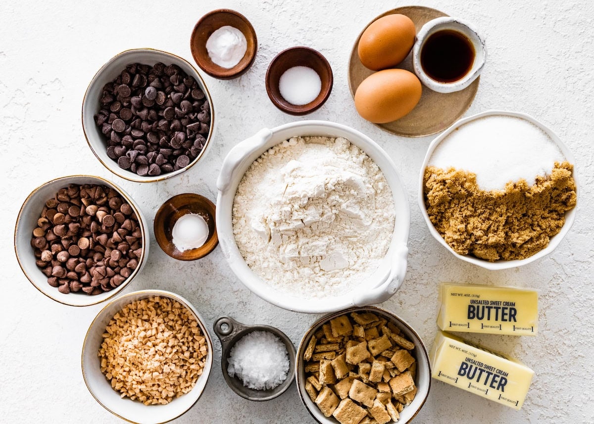 ingredients in bowls to make graham cracker toffee chocolate chip cookies.