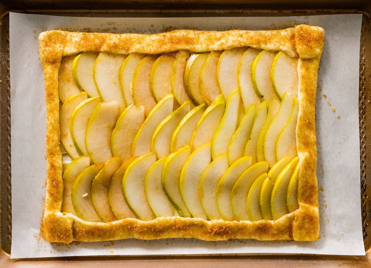 pear slices arranged on puff pastry sheet and sprinkled with turbinado sugar.