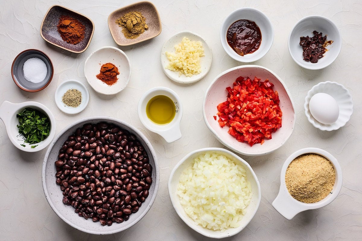 ingredients in bowls to make black bean burger.