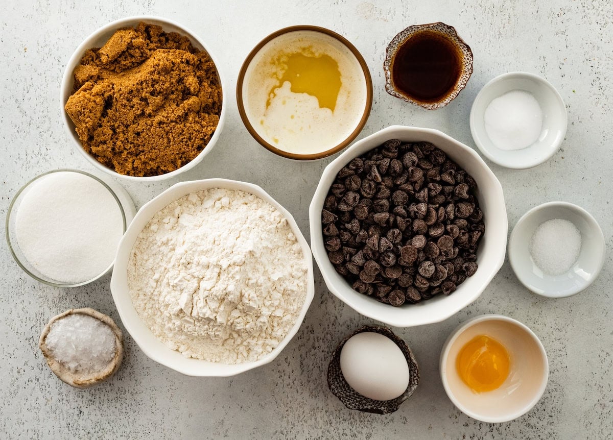 ingredients in bowls to make chocolate chip cookie bars.