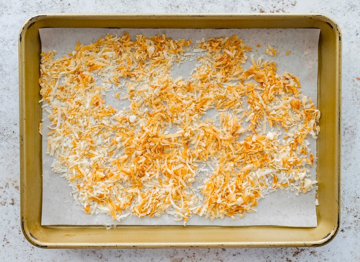 toasted coconut on baking sheet with parchment paper.