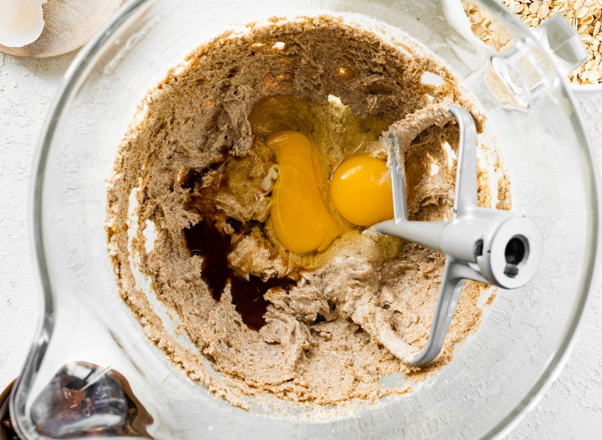 creamed butter and sugars with eggs and vanilla extract in mixing bowl.