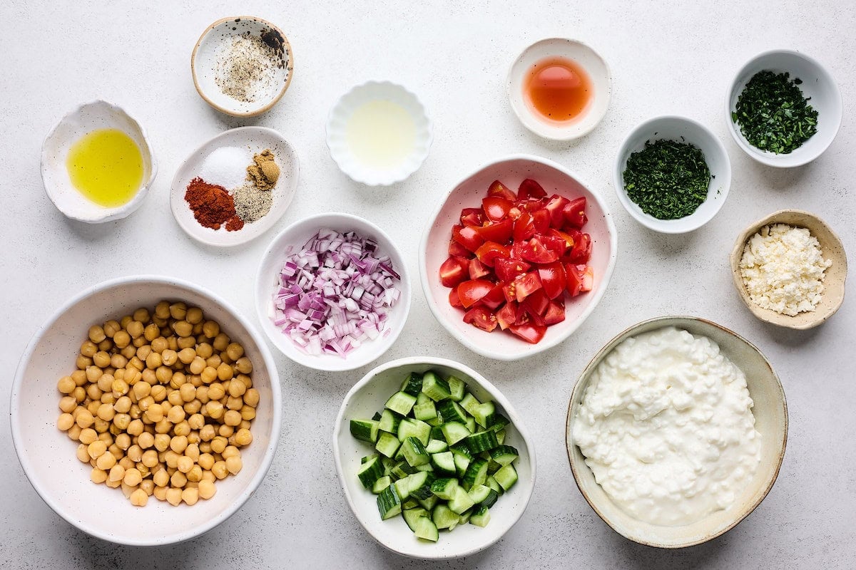 ingredients in bowls to make cottage cheese salad.