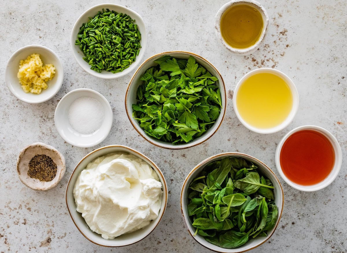 ingredients in bowls to make green goddess dressing.