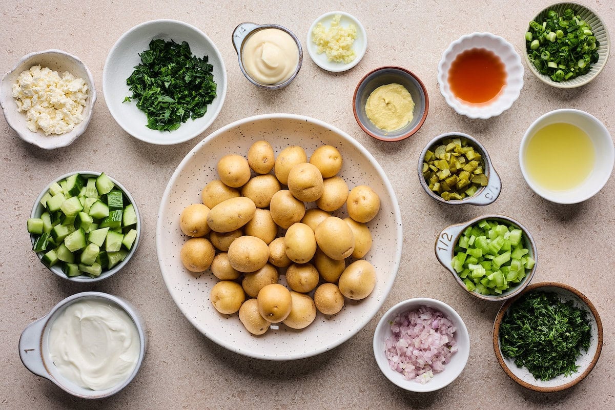 ingredients in bowls to make smashed potato salad.