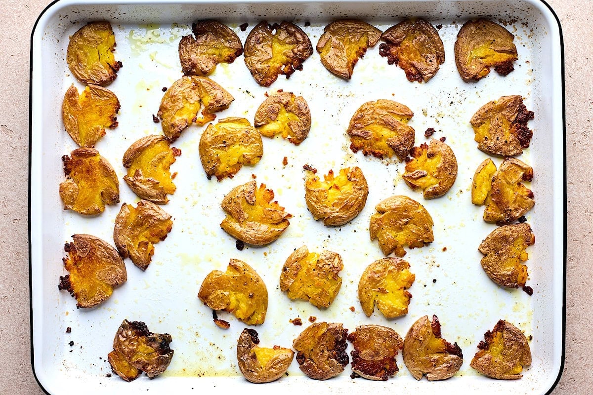 crispy smashed potatoes on baking sheet.