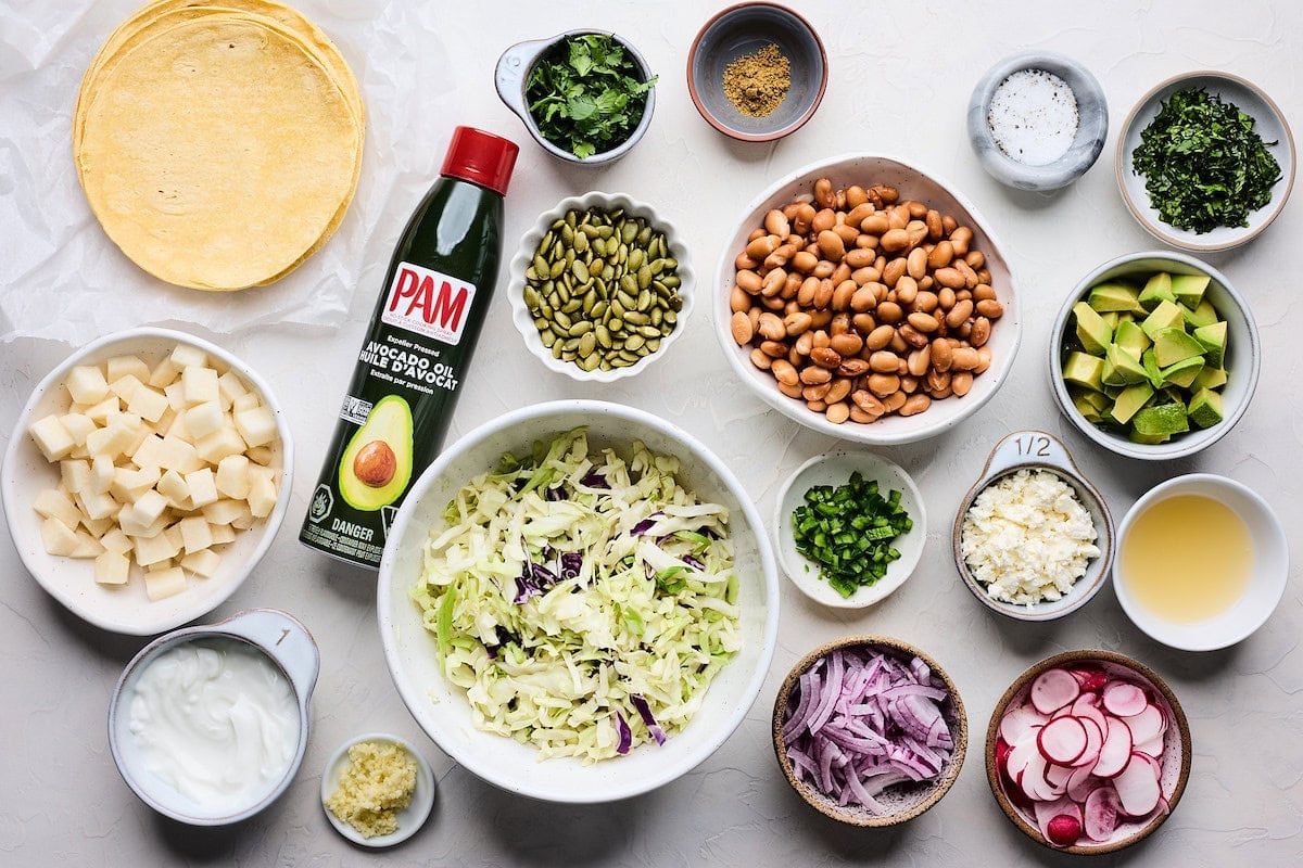 ingredients in bowls to make crispy southwestern salad tostadas.