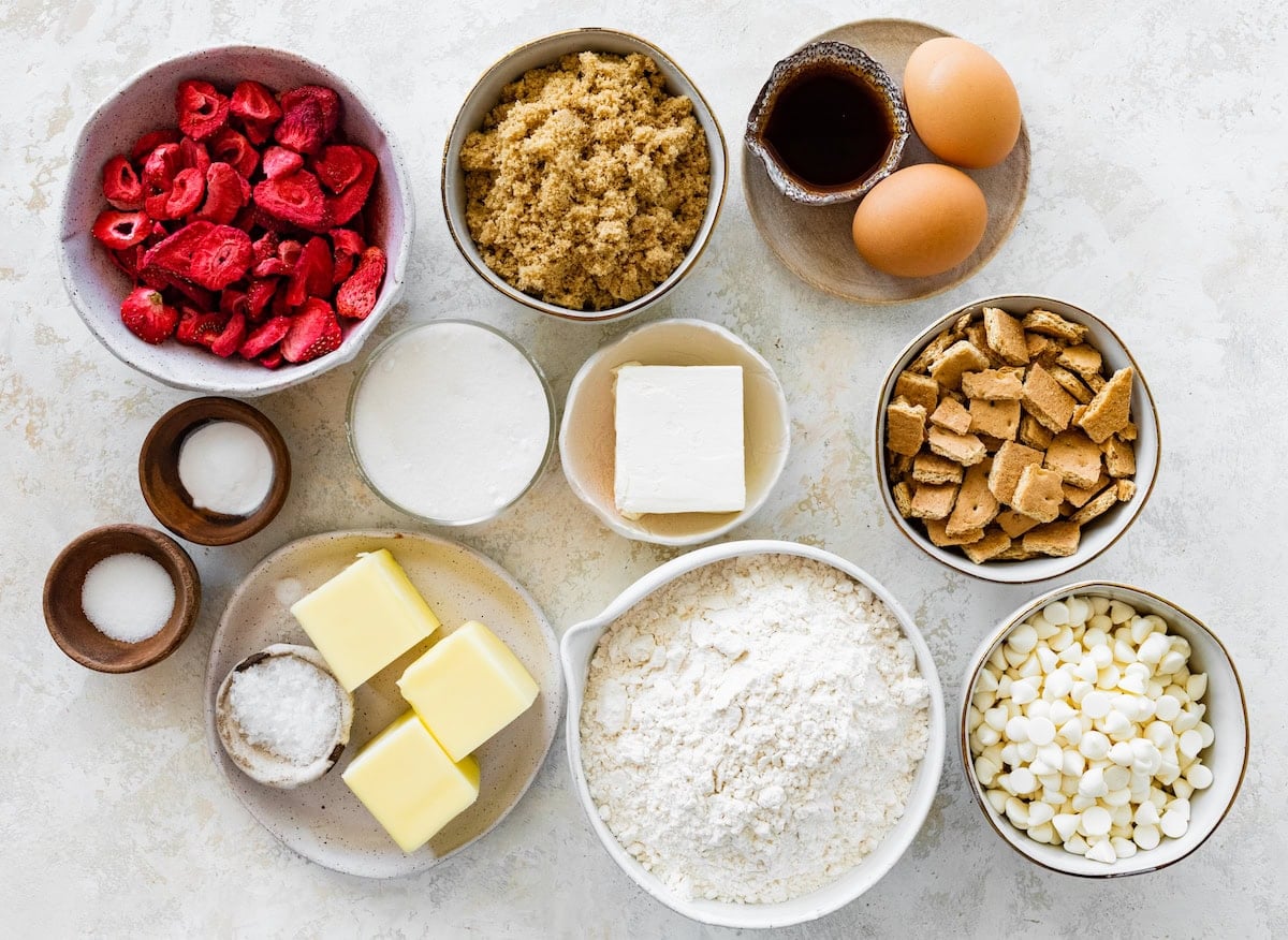 ingredients in bowls to make strawberry cheesecake cookies.
