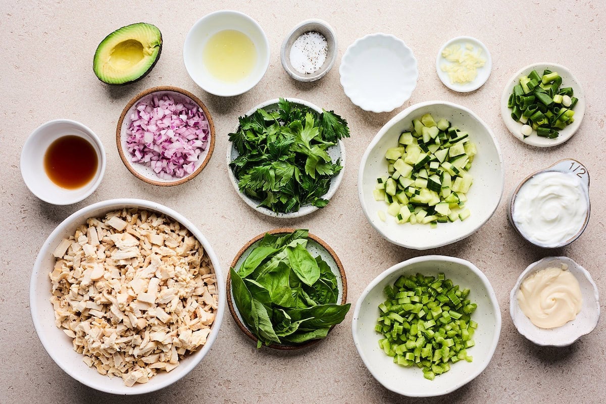 ingredients in bowls to make green goddess chicken salad.