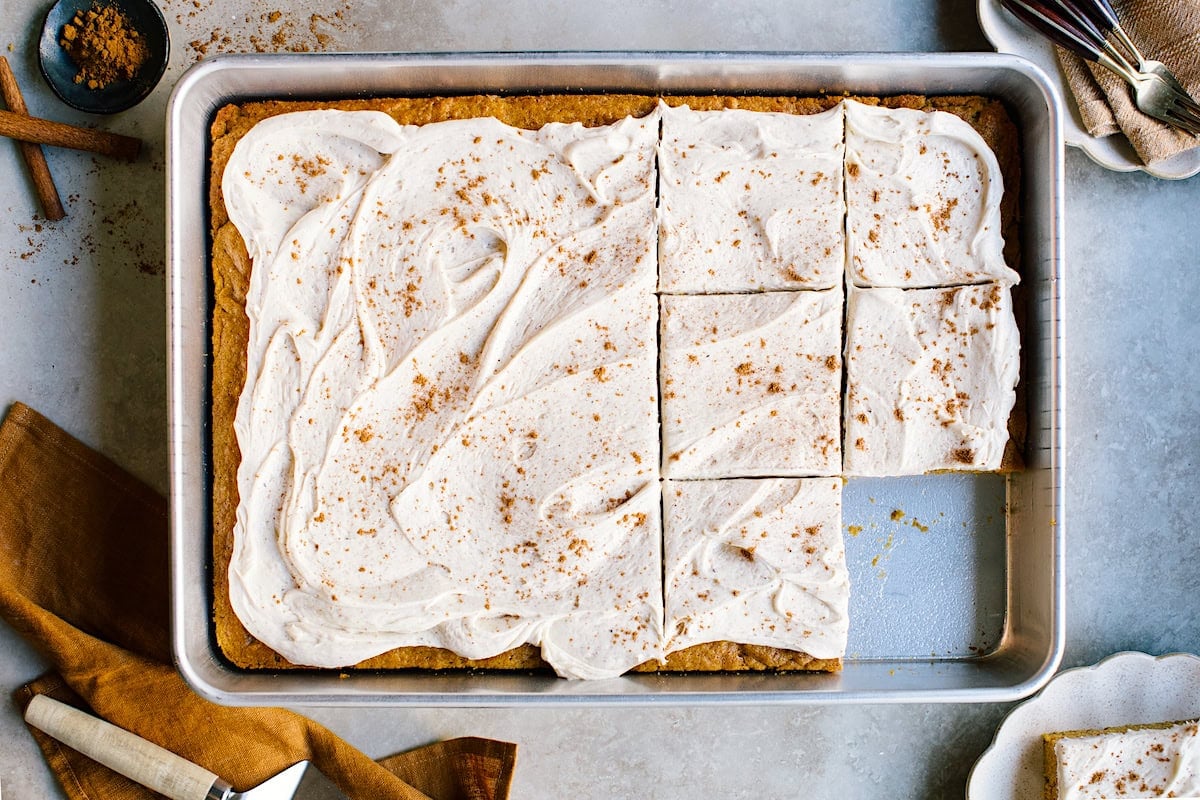 pumpkin sheet cake with brown butter cream cheese frosting in pan.