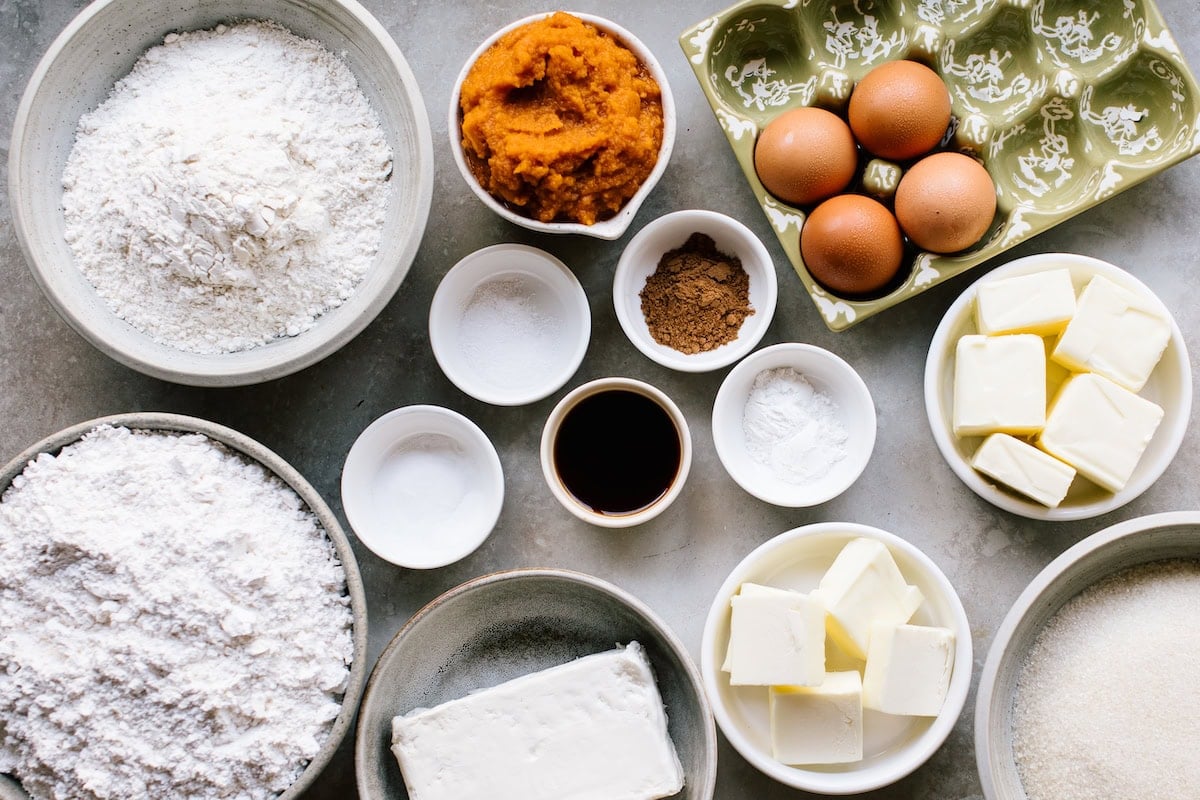 ingredients to make pumpkin sheet cake with brown butter cream cheese frosting.