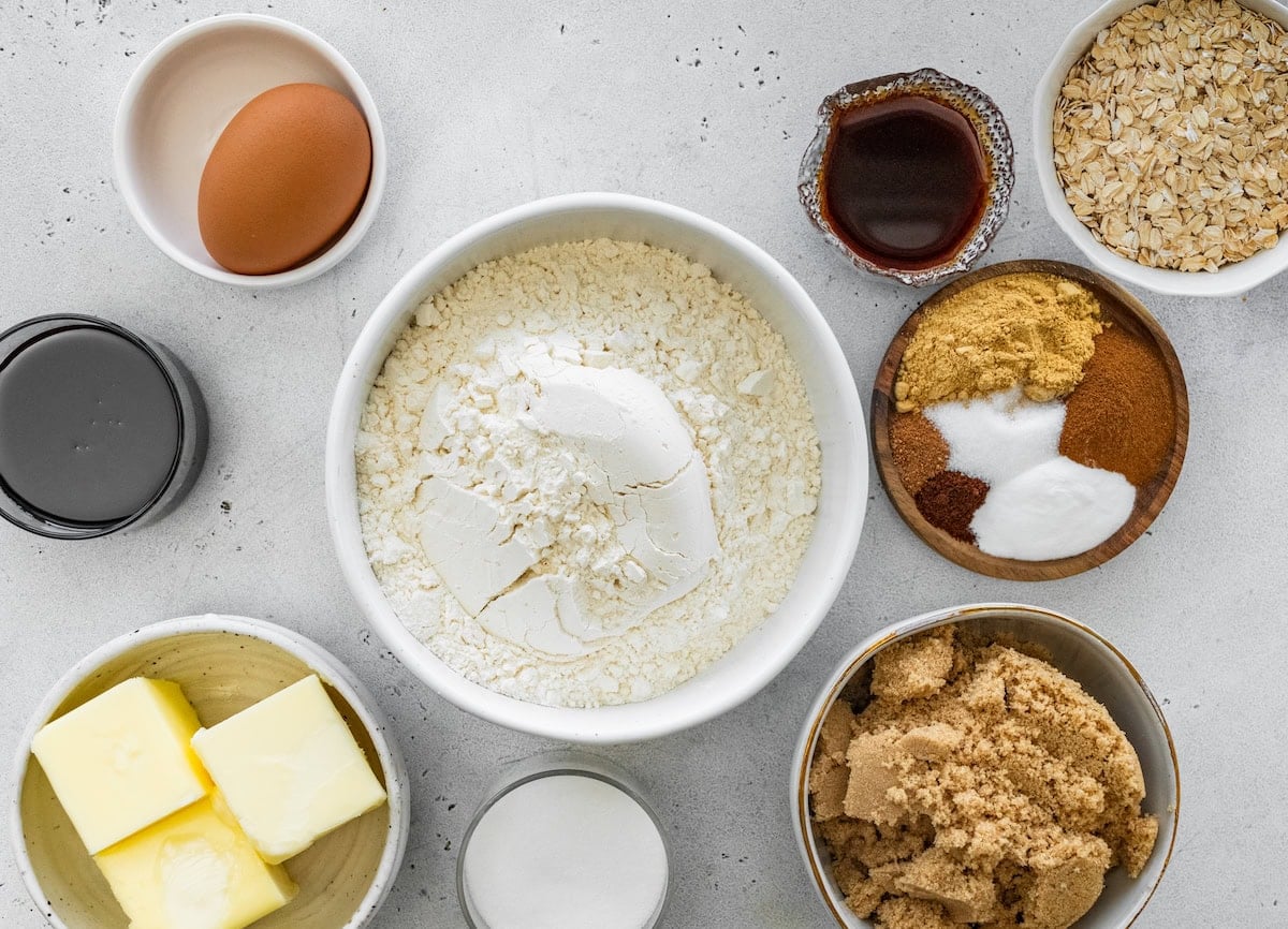 ingredients in bowls to make gingerbread oatmeal cream pies.