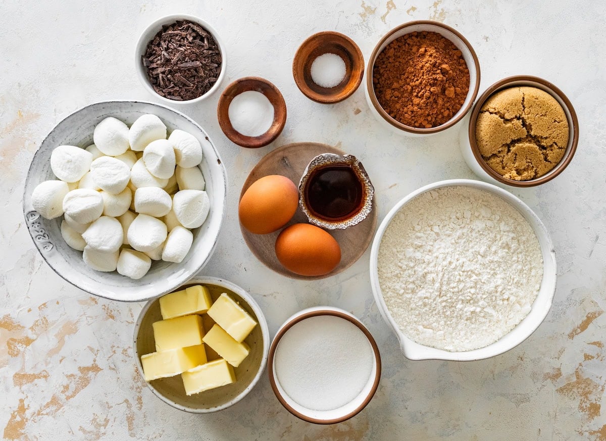 ingredients in bowls to make hot cocoa cookies. 
