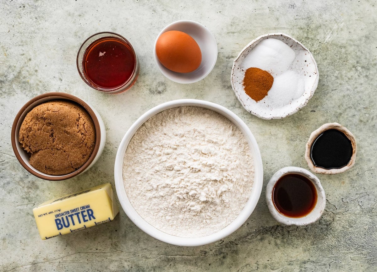 ingredients in bowls to make maple pecan cookies.
