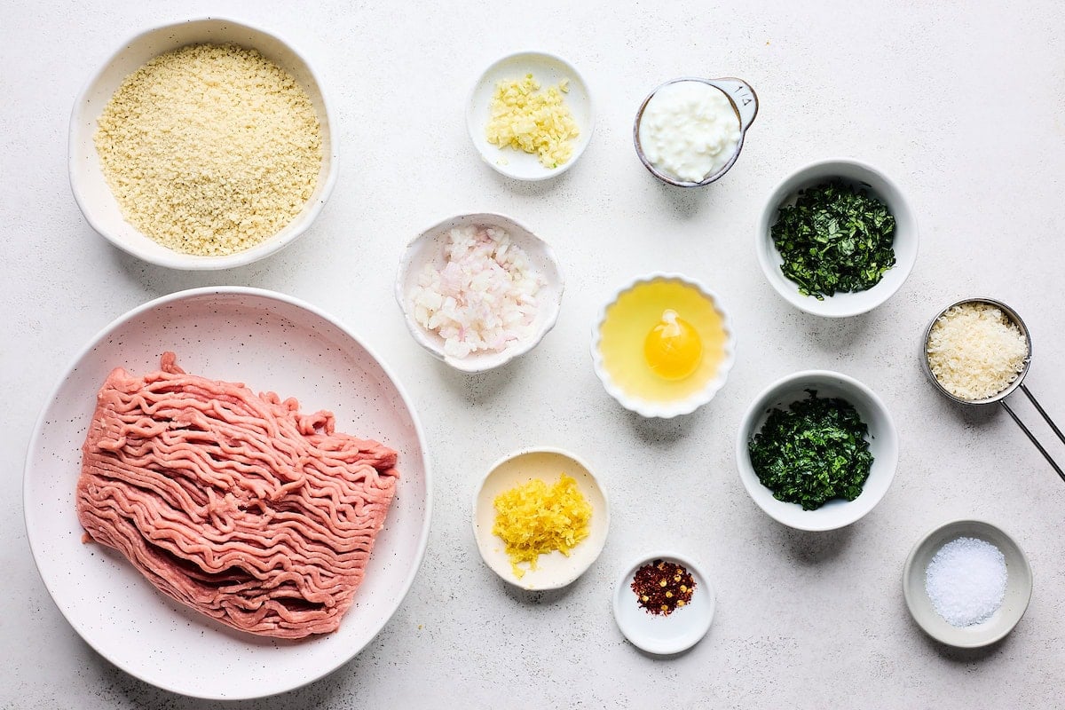 ingredients in bowls to make lemon herb meatballs.