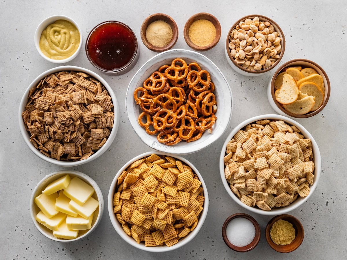 ingredients in bowls to make hot honey chex mix.