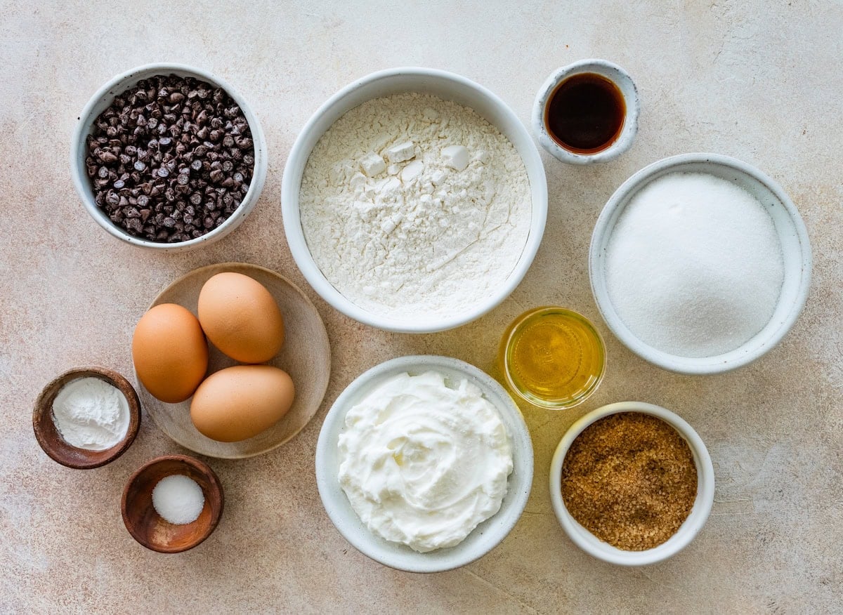 ingredients in bowls to make easy chocolate chip cake.