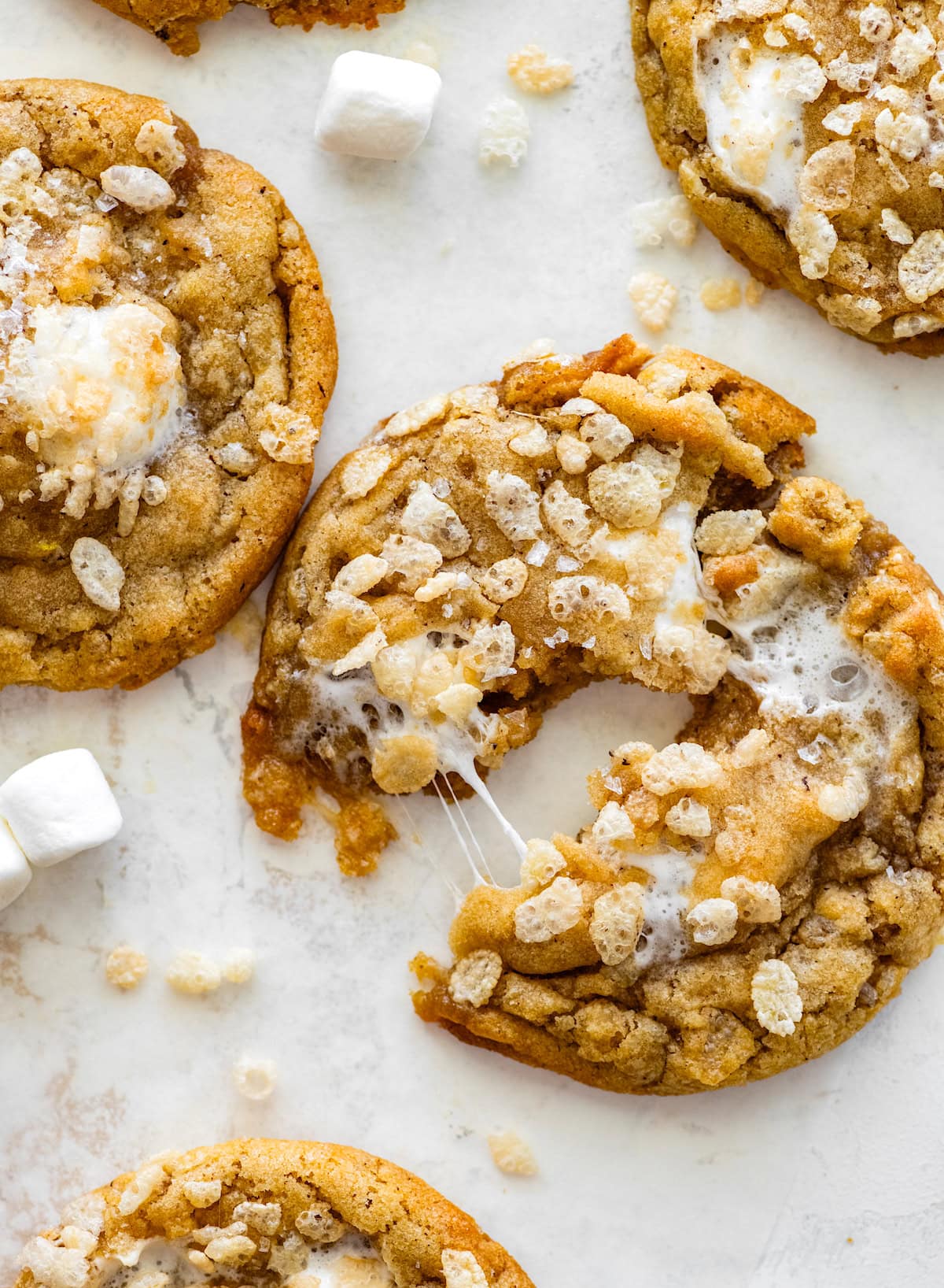 rice krispie treat cookie broke in half with gooey marshmallow.