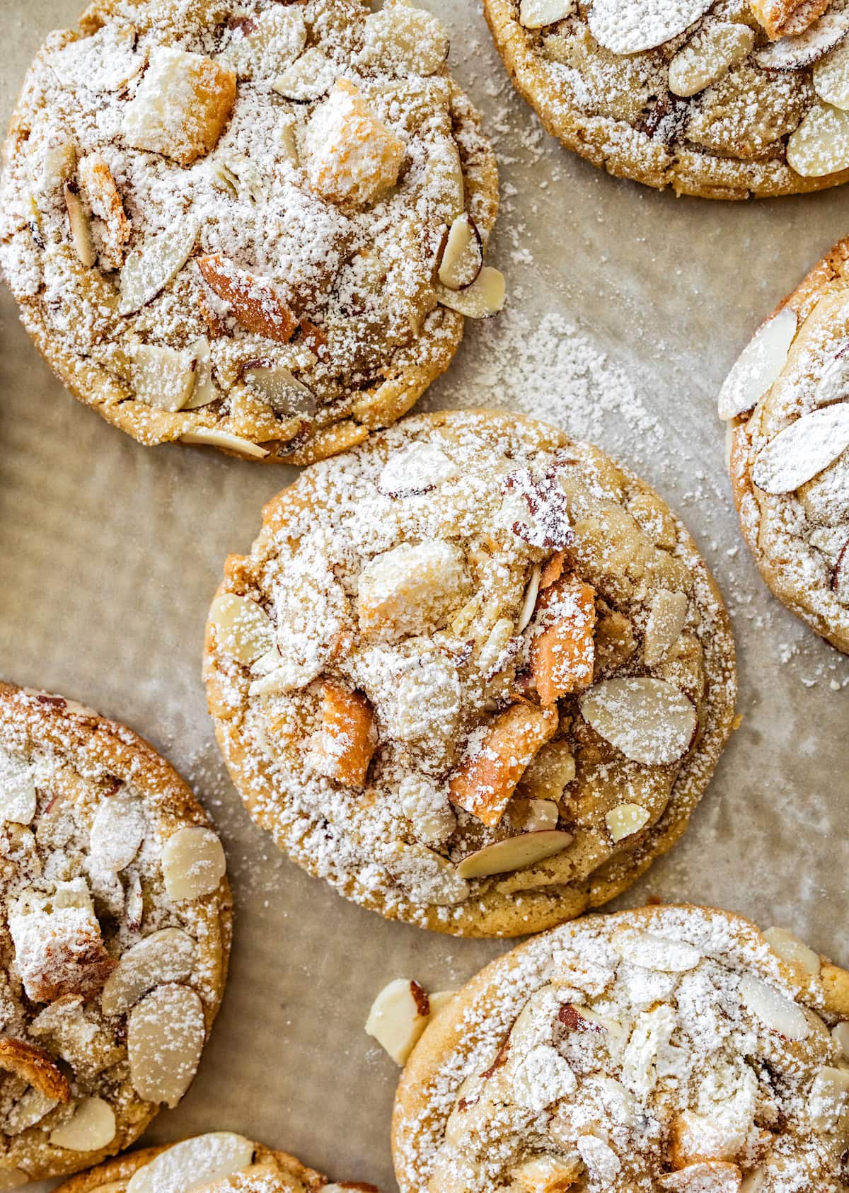 almond croissant cookies with croissant pieces, almonds, and powdered sugar.
